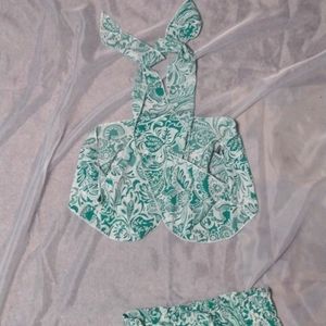 Cute cover up pants have a high split and comes with matching halter type top